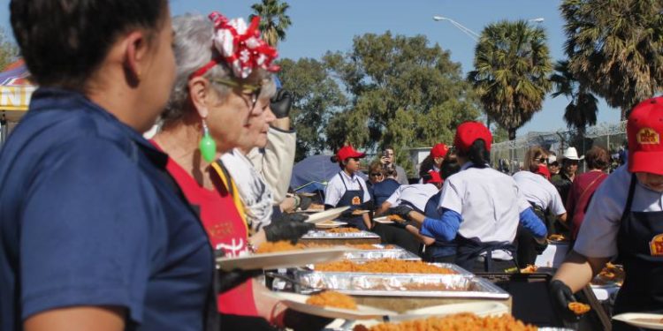 Waiting At The Border For The Holidays: Volunteers Give Meals And Gifts To Migrants