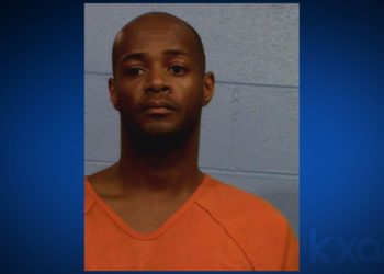 Police: Man drove away with repo man stuck in car door