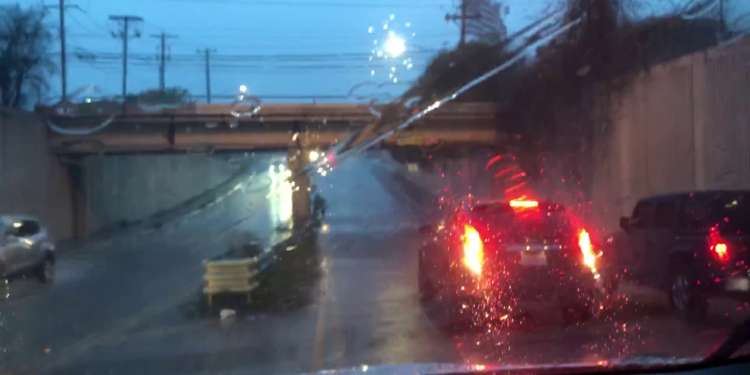 Flooding on Steck Ave. under train overpass near MoPac