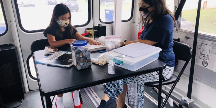 How one school district is closing the equity gap with a school bus and a card table