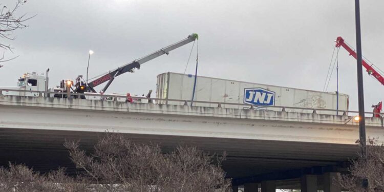 Police identify semi-truck driver who died after cab went over upper deck of I-35